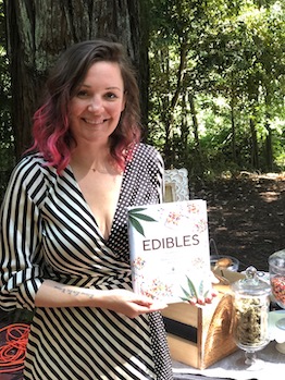 Coreen Carrol holding her cookbook
